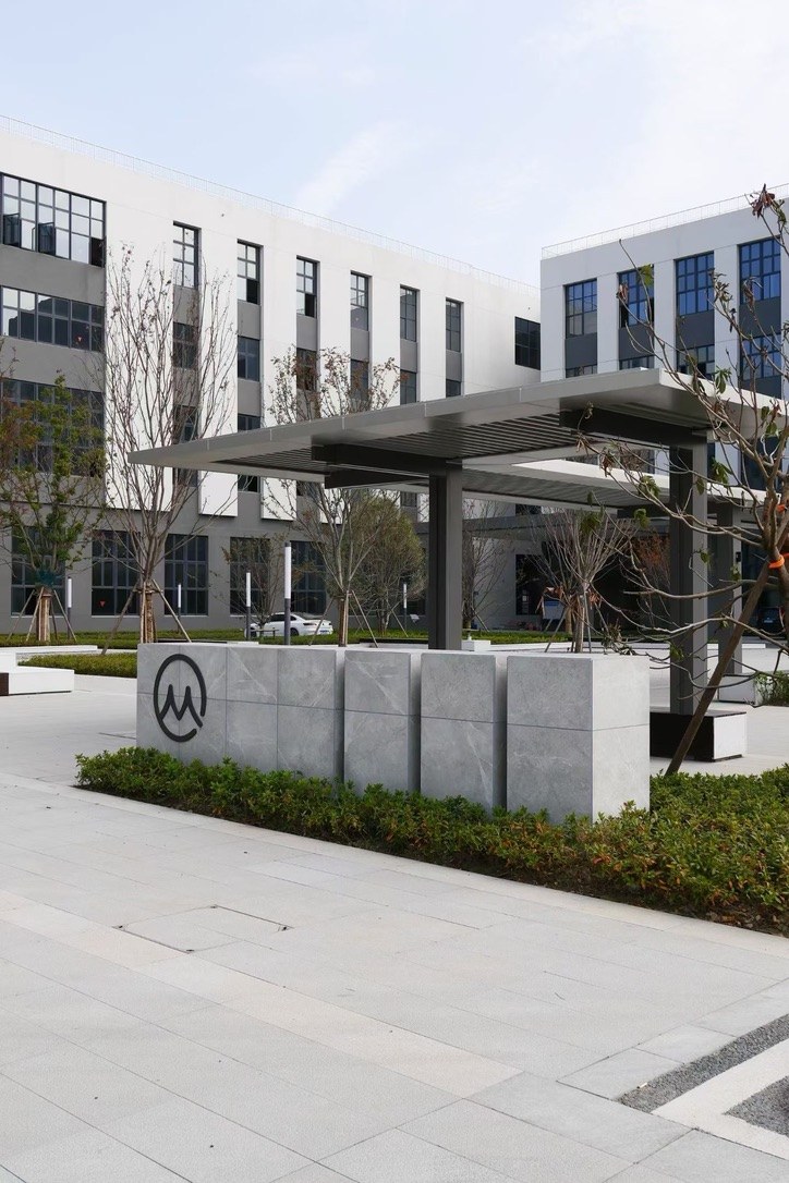 MEGEE campus signage and entrance canopy